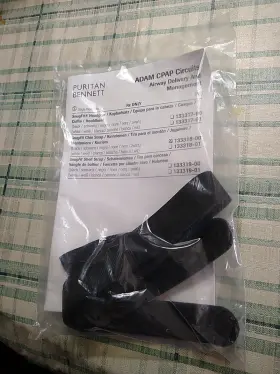 133318-00 Puritan Bennett Snugfit Black Chin Strap With Booklet #133318-00 Sealed