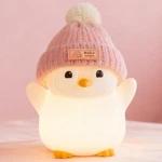 Famiduo Penguin Night Light, Cute Pink Lamp With Knit Hat, Stand New. Price: $30.99.