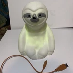 Art + Sound Sloth Dancing Lights Wireless Speaker Charging Pictured Here Used. Price: $14.95.